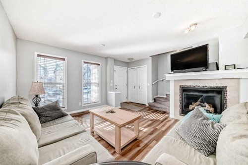 6 Elgin Meadows Gardens Se, Calgary, AB - Indoor Photo Showing Living Room With Fireplace