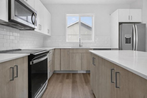 403-137 Red Embers Link Ne, Calgary, AB - Indoor Photo Showing Kitchen With Upgraded Kitchen