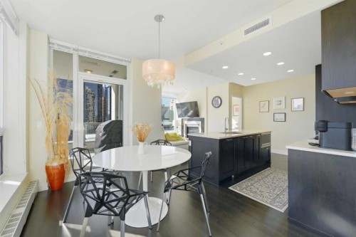 825-222 Riverfront Avenue Sw, Calgary, AB - Indoor Photo Showing Dining Room With Fireplace