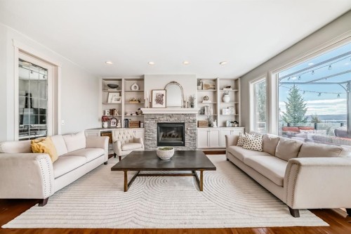 268 Springbluff Bay Sw, Calgary, AB - Indoor Photo Showing Living Room With Fireplace
