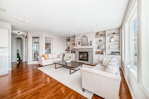 268 Springbluff Bay Sw, Calgary, AB - Indoor Photo Showing Living Room With Fireplace