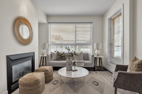 409-1000 Centre Avenue Ne, Calgary, AB - Indoor Photo Showing Living Room With Fireplace