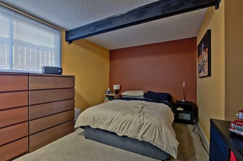 80 Queen Alexandra Close Se, Calgary, AB - Indoor Photo Showing Bedroom