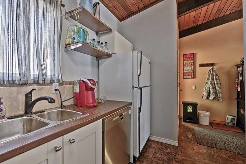 80 Queen Alexandra Close Se, Calgary, AB - Indoor Photo Showing Kitchen With Double Sink