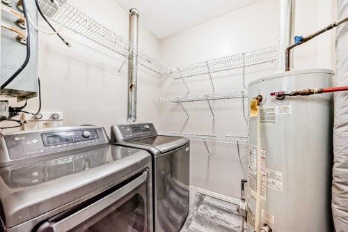 205-7 Lineham Avenue, Okotoks, AB - Indoor Photo Showing Laundry Room