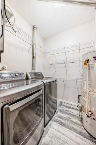 205-7 Lineham Avenue, Okotoks, AB - Indoor Photo Showing Laundry Room