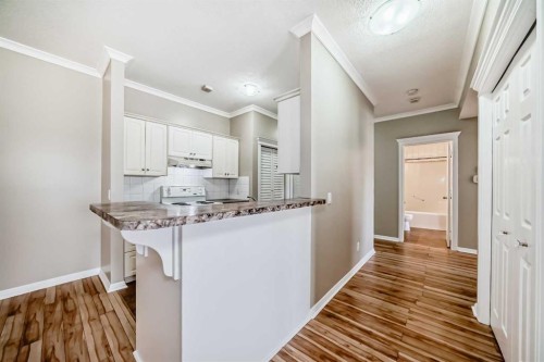 205-7 Lineham Avenue, Okotoks, AB - Indoor Photo Showing Kitchen