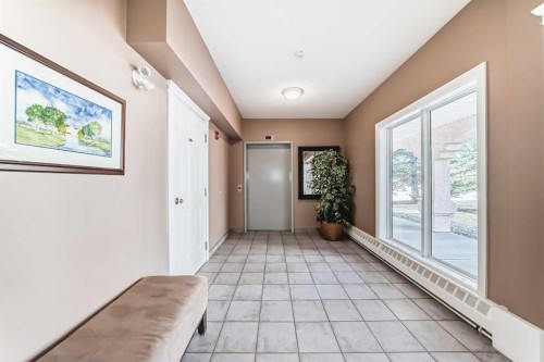 205-7 Lineham Avenue, Okotoks, AB - Indoor Photo Showing Other Room