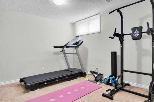 4224 Worcester Drive Sw, Calgary, AB - Indoor Photo Showing Gym Room