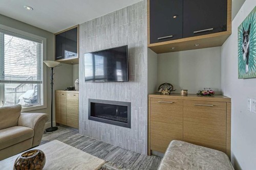 2418 24A Street Sw, Calgary, AB - Indoor Photo Showing Living Room With Fireplace