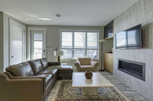 2418 24A Street Sw, Calgary, AB - Indoor Photo Showing Living Room With Fireplace