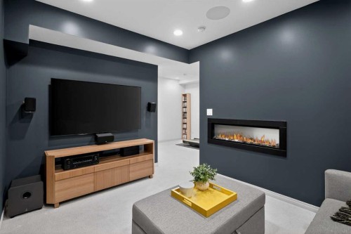 228 Mahogany Grove Se, Calgary, AB - Indoor Photo Showing Living Room With Fireplace