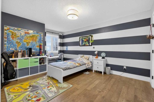 105 Westpoint Way Sw, Calgary, AB - Indoor Photo Showing Bedroom