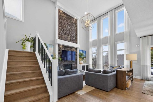 105 Westpoint Way Sw, Calgary, AB - Indoor Photo Showing Living Room With Fireplace