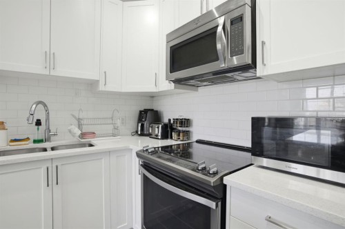 164 Evanscrest Gardens Nw, Calgary, AB - Indoor Photo Showing Kitchen With Stainless Steel Kitchen With Double Sink With Upgraded Kitchen