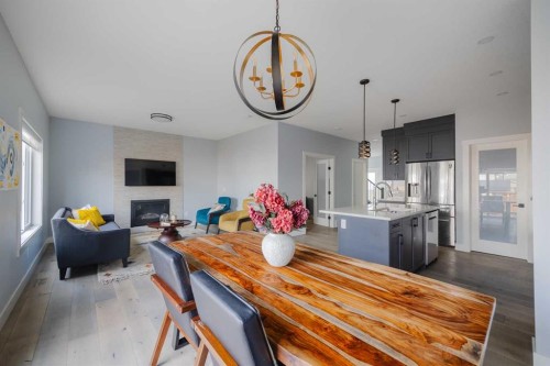 62 Legacy Glen Terrace Se, Calgary, AB - Indoor Photo Showing Dining Room With Fireplace