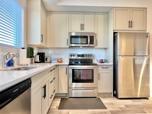 144 Carrington Boulevard Nw, Calgary, AB - Indoor Photo Showing Kitchen With Stainless Steel Kitchen With Upgraded Kitchen