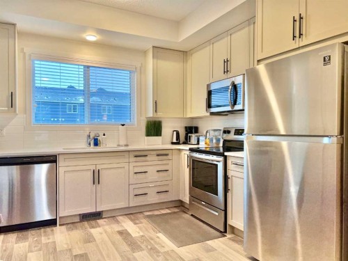 144 Carrington Boulevard Nw, Calgary, AB - Indoor Photo Showing Kitchen With Stainless Steel Kitchen With Upgraded Kitchen