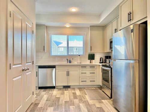 144 Carrington Boulevard Nw, Calgary, AB - Indoor Photo Showing Kitchen With Stainless Steel Kitchen