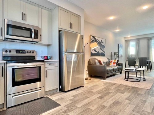 144 Carrington Boulevard Nw, Calgary, AB - Indoor Photo Showing Kitchen With Stainless Steel Kitchen
