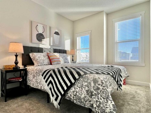 144 Carrington Boulevard Nw, Calgary, AB - Indoor Photo Showing Bedroom