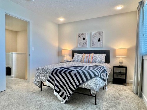 144 Carrington Boulevard Nw, Calgary, AB - Indoor Photo Showing Bedroom