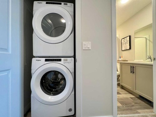 144 Carrington Boulevard Nw, Calgary, AB - Indoor Photo Showing Laundry Room