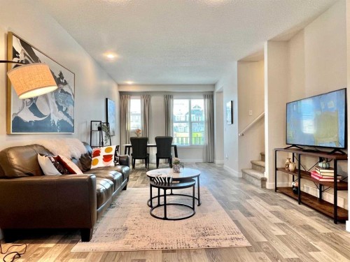 144 Carrington Boulevard Nw, Calgary, AB - Indoor Photo Showing Living Room