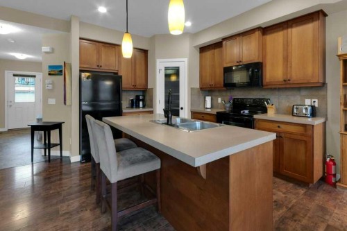 609-413 River Avenue, Cochrane, AB - Indoor Photo Showing Kitchen With Double Sink