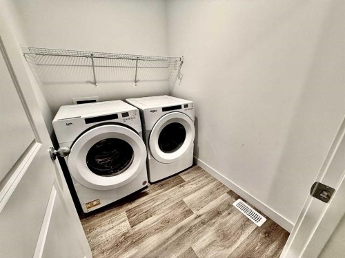 189 Carringvue Way Nw, Calgary, AB - Indoor Photo Showing Laundry Room