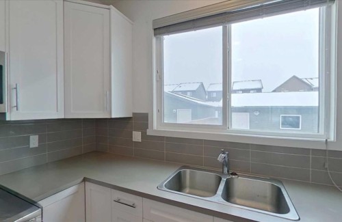 189 Carringvue Way Nw, Calgary, AB - Indoor Photo Showing Kitchen With Double Sink