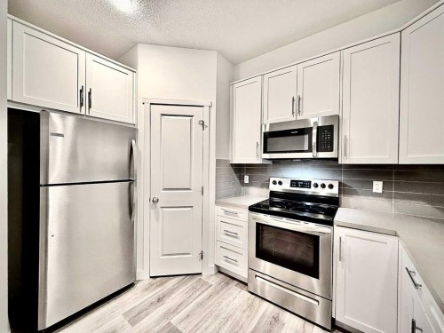 189 Carringvue Way Nw, Calgary, AB - Indoor Photo Showing Kitchen