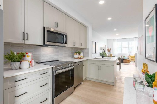 78 Heirloom Passage Se, Calgary, AB - Indoor Photo Showing Kitchen With Upgraded Kitchen