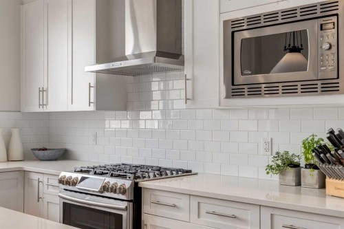 128 Heritage Heights, Cochrane, AB - Indoor Photo Showing Kitchen With Upgraded Kitchen