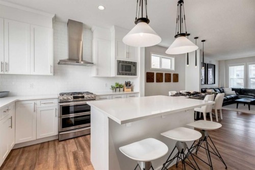 128 Heritage Heights, Cochrane, AB - Indoor Photo Showing Kitchen With Upgraded Kitchen