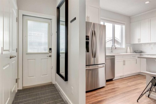 128 Heritage Heights, Cochrane, AB - Indoor Photo Showing Kitchen