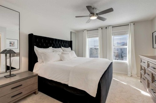 128 Heritage Heights, Cochrane, AB - Indoor Photo Showing Bedroom