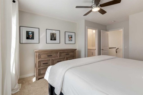 128 Heritage Heights, Cochrane, AB - Indoor Photo Showing Bedroom