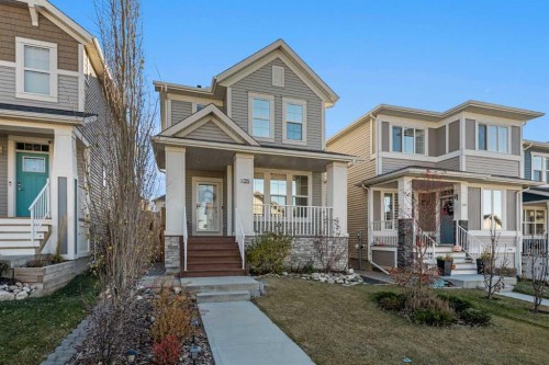 128 Heritage Heights, Cochrane, AB - Outdoor With Deck Patio Veranda With Facade