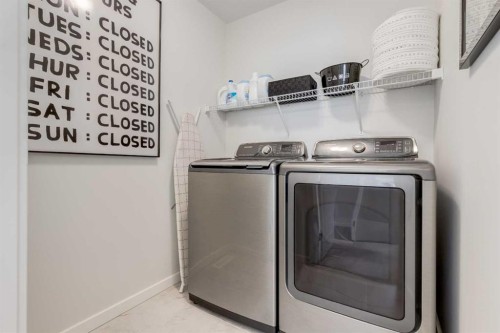 128 Heritage Heights, Cochrane, AB - Indoor Photo Showing Laundry Room