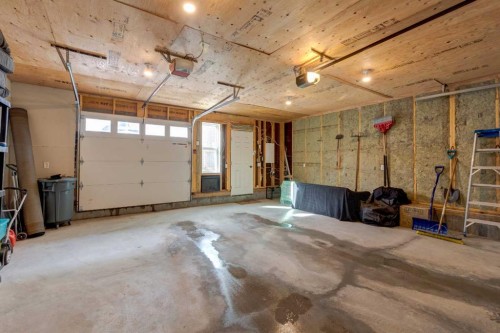 128 Heritage Heights, Cochrane, AB - Indoor Photo Showing Garage