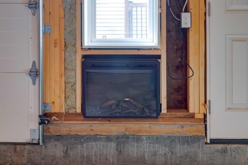 128 Heritage Heights, Cochrane, AB - Indoor Photo Showing Other Room