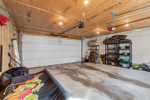 128 Heritage Heights, Cochrane, AB - Indoor Photo Showing Garage