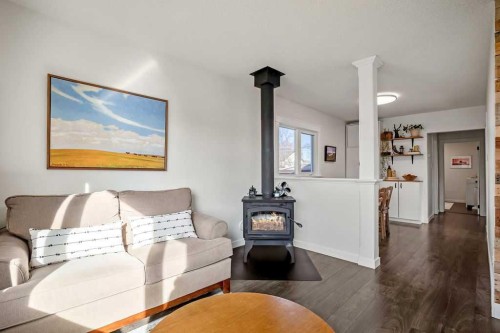 330 3 Avenue Se, High River, AB - Indoor Photo Showing Living Room With Fireplace