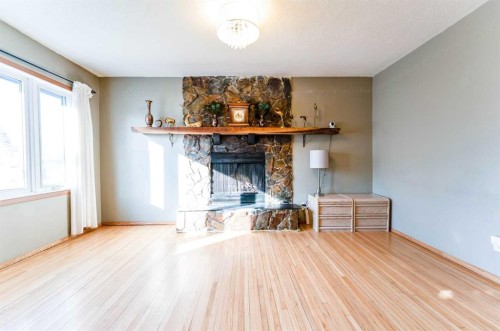 2018 Cottonwood Crescent Se, Calgary, AB - Indoor Photo Showing Other Room With Fireplace