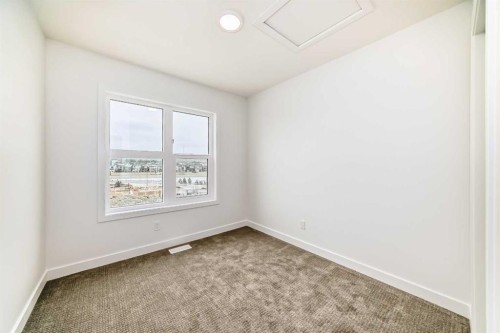 86 Heirloom Passage Se, Calgary, AB - Indoor Photo Showing Other Room