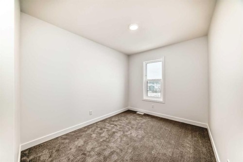 86 Heirloom Passage Se, Calgary, AB - Indoor Photo Showing Other Room