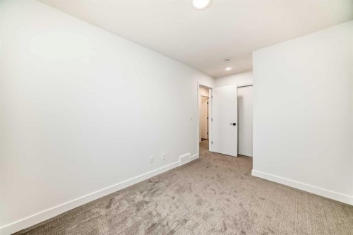 86 Heirloom Passage Se, Calgary, AB - Indoor Photo Showing Other Room