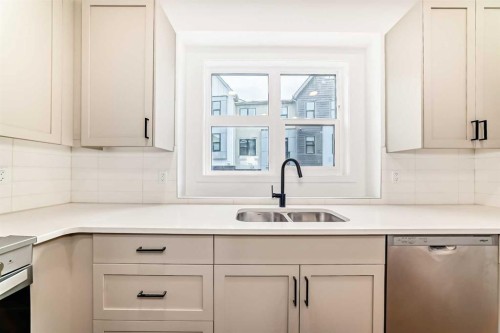 86 Heirloom Passage Se, Calgary, AB - Indoor Photo Showing Kitchen With Double Sink