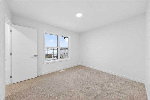 90 Heirloom Passage Se, Calgary, AB - Indoor Photo Showing Other Room